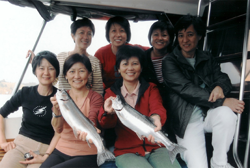 family with fish caught on lake taupo
